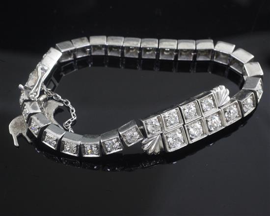 A 1930s/1940s platinum? and graduated diamond set line bracelet, 16.5cm.